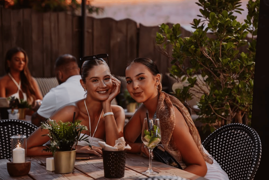 Two Girls Enjoying the sunset at Blackbeard's Beach Bar and Grill Magaluf