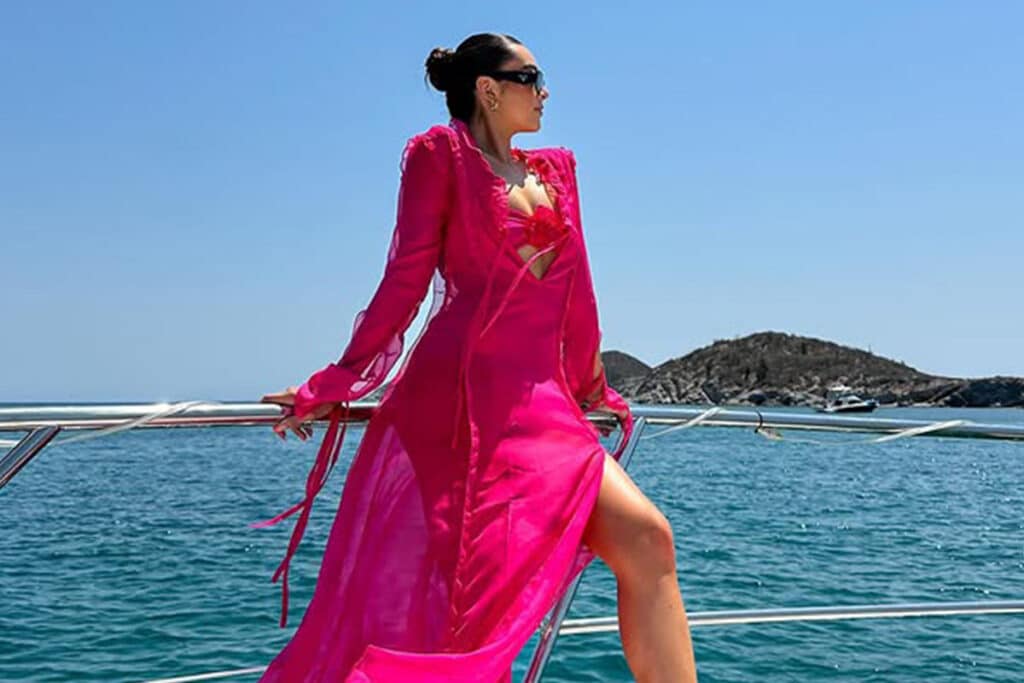 Lady wearing a coverup on a boat party